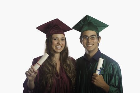 graduates in cap and gown with diplomas