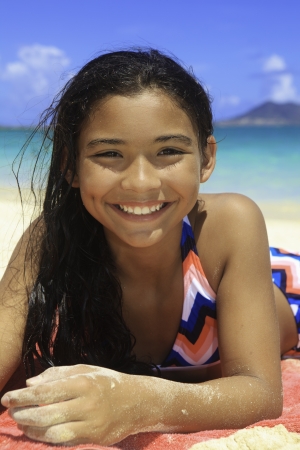pretty polynesian girl at the beachの写真素材