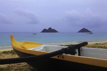outrigger canoe on the beach in hawaii at dusk