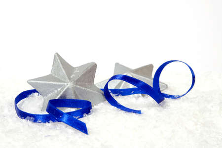 Silver stars with the blue ribbon on the white backgroundの写真素材
