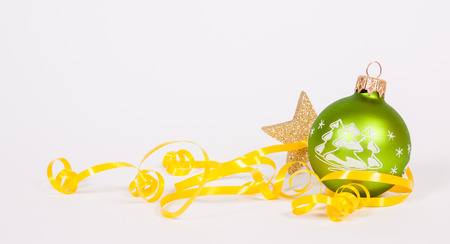 Green glass ball on the white backgroundの写真素材