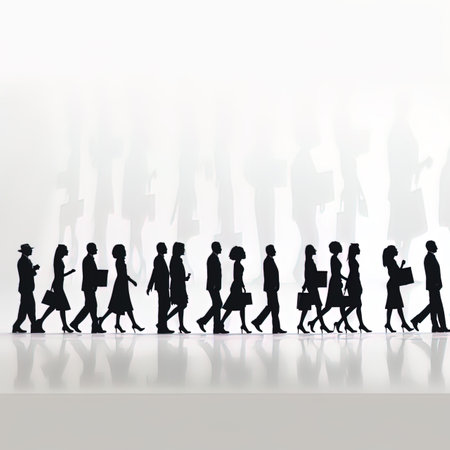 Silhouettes of business people walking in front of a white backgroundの写真素材