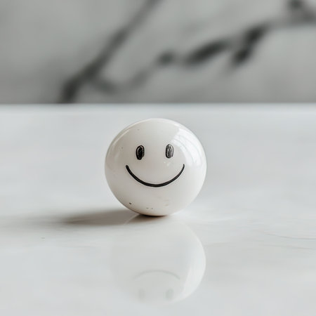 Smiling white ball on a white table with a marble background.の写真素材