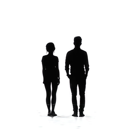 Silhouette of a man and a woman standing back to back on a white backgroundの写真素材