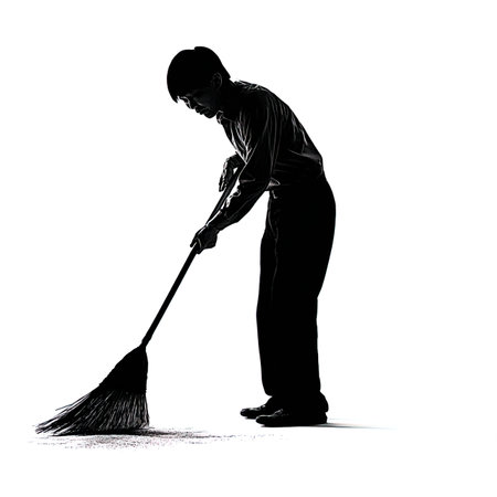 A silhouette of a man sweeping the floor with a broom on a white backgroundの写真素材