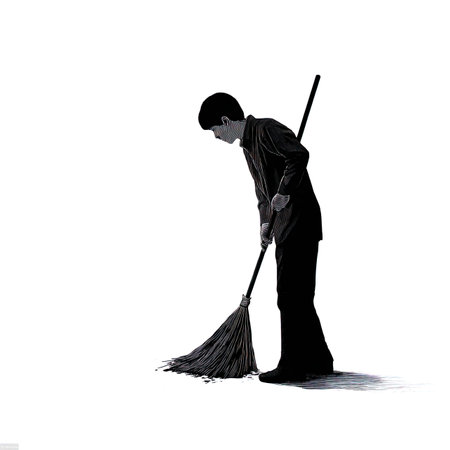 Silhouette of a man with a broom on a white backgroundの写真素材
