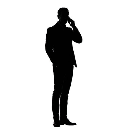 Silhouette of a man talking on the phone on a white background.の写真素材