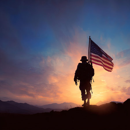 Silhouette of soldier with american flag on sunset sky backgroundの写真素材