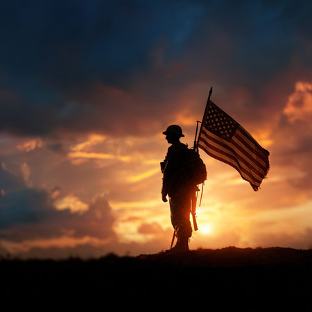 Silhouette of soldier with the american flag on sunset backgroundの写真素材