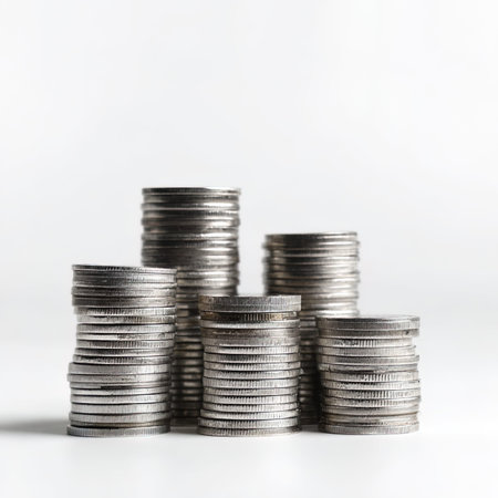 Stacks of coins on white background, business and finance concept.