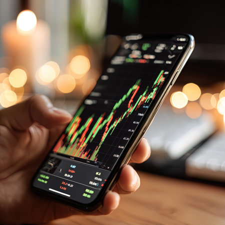 business, technology, internet and stock concept - close up of man with smartphone and stock market...