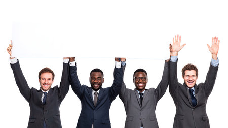 Happy business people holding blank banner over white background. Business concept.の写真素材