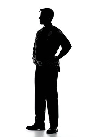 one caucasian police man standing full length silhouette isolated on white backgroundの写真素材