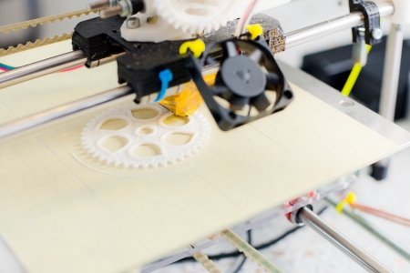 Electronic three dimensional plastic printer during work in school laboratory 