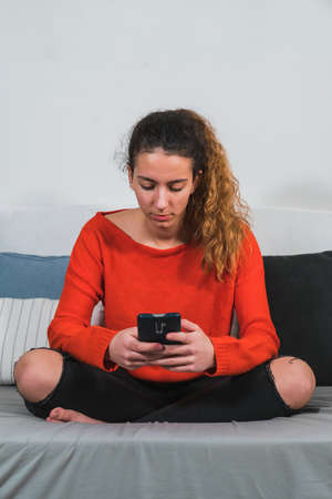 New normal. Young teenager with a mask walking around with a suitcase on the street. Protected tourist with a mask walking down the street with his suitcase. Airport. Train stationの写真素材