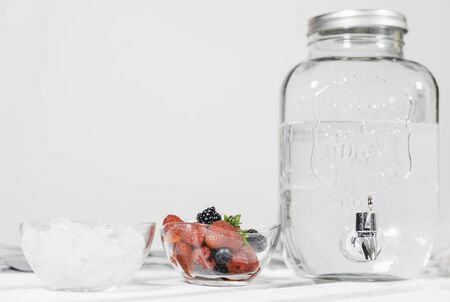 Water with a taste of berries. Water with a taste of red fruits. Cocktail. Summer drink. Refreshing drink. Ingredients for preparing red fruits flavored water.の写真素材