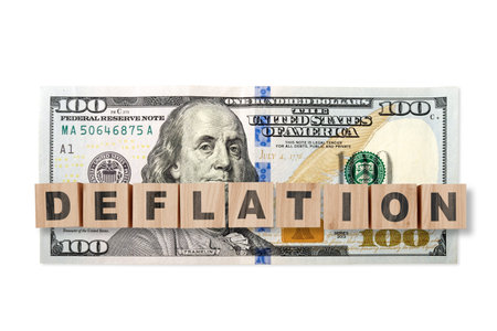 100 US dollar note on a USA flag with wooden cubes and word DEFLATION. USA trade, duty, customs and...