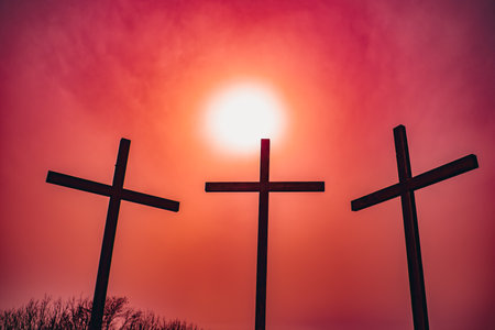 Cross at sunset.Red sky in Italy.の写真素材