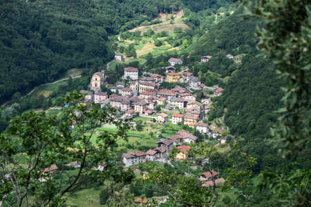 A small Italian village hidden in a forest mountain valley