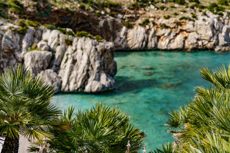 Tall rocks jutting out of the beautiful turquoise warm sea.の写真素材