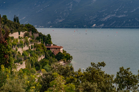 Built-up slope overlooking the mountains and lake.の写真素材