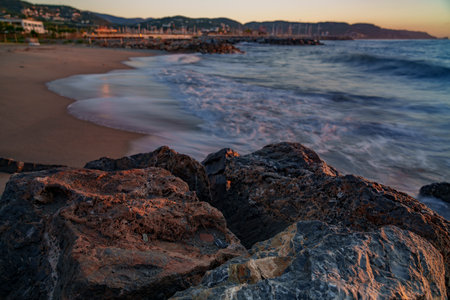 Atmospheric view of the sea, where the waves are blurred with atmospheric lightの写真素材