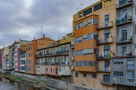 The colorful buildings of the old town above a peaceful river.の写真素材