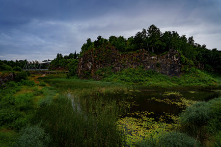 Scenic limestone hill and pond at Kadzielnia Nature Reserve in Kielce, Poland.の写真素材