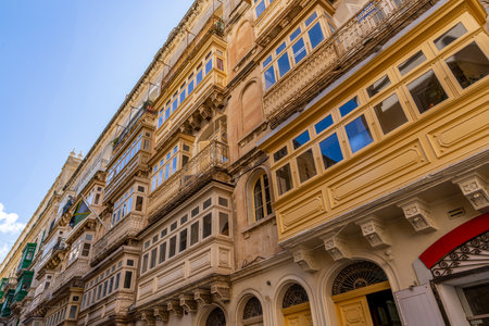 Rows of classic, ornate, colorful wooden balconies line the facade of historic city buildings.