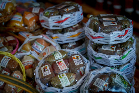 Closeup of round woven gift baskets packed with various traditional Georgian nut and fruit sweetsの写真素材