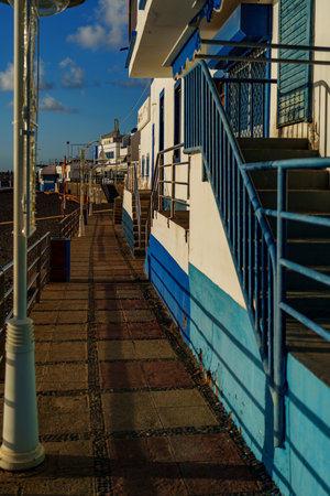 Old buoys and tangled cords form a textured still life with bright coastal color.の写真素材