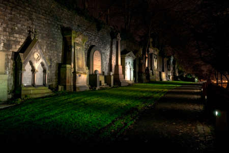 Cemetery on a hill at night in Glasgowの写真素材