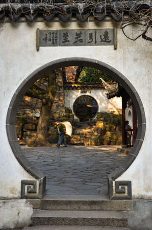 Chinese man carrying stuff on his back.のeditorial素材