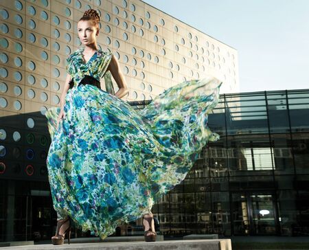 Sexy young beauty posing over urban backgroundの写真素材