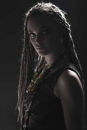 Portrait of young beautiful girl with stylish make-up and dreadsの写真素材