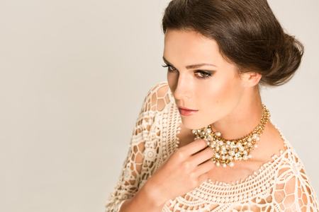 Sexy Brunette in lacing blouse with jewellery lookiの写真素材