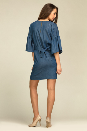 Young model wearing blue, jeans dress with slim bodyの写真素材