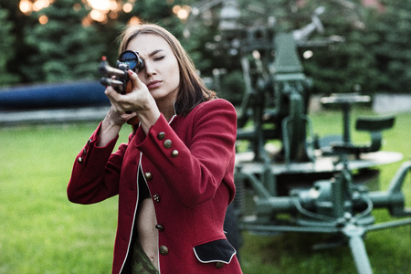 Shooting women holding a gunの写真素材