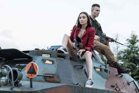 Couple of soldiers sitting on the tankの写真素材