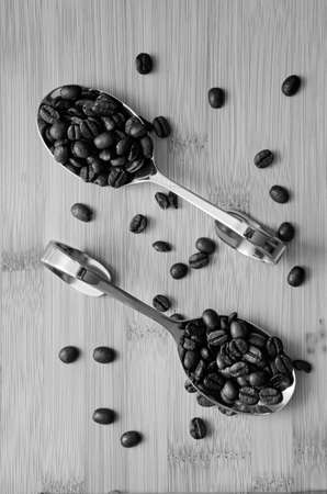 Aromatic coffee spilled on a spoon.の写真素材