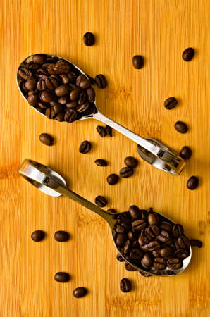 Aromatic coffee spilled on a spoon.の写真素材