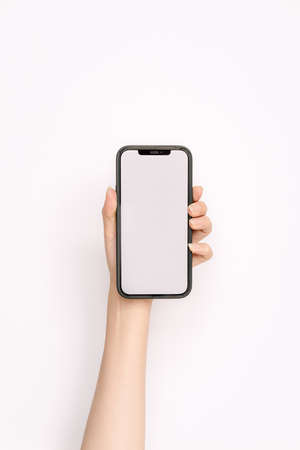 woman's hand holding a mobile phoneの写真素材