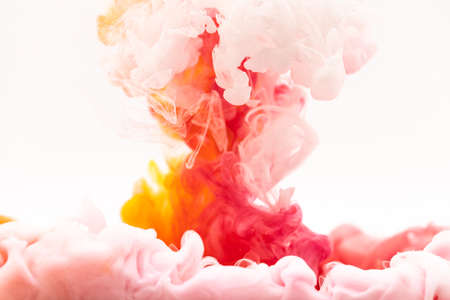 red yellow white smoke over white backgroundの写真素材