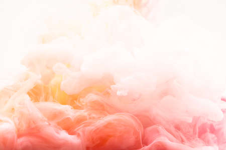 red yellow white smoke over white backgroundの写真素材