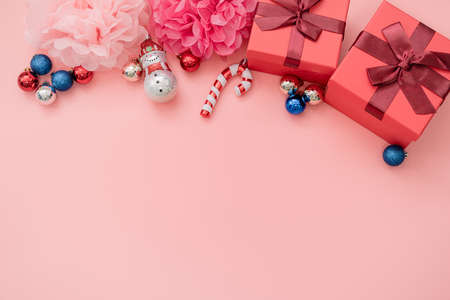 Various Christmas props on a pink backgroundの写真素材