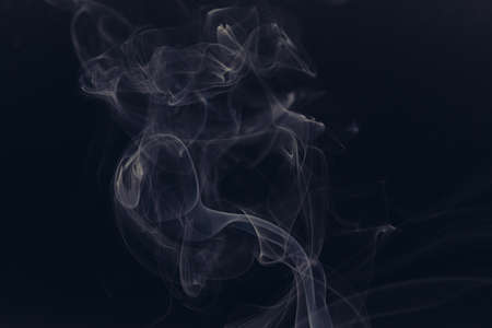white smoke on a black backgroundの写真素材