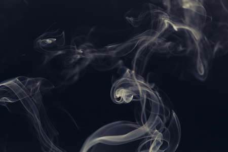 white smoke on a black backgroundの写真素材
