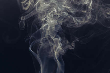 white smoke on a black backgroundの写真素材