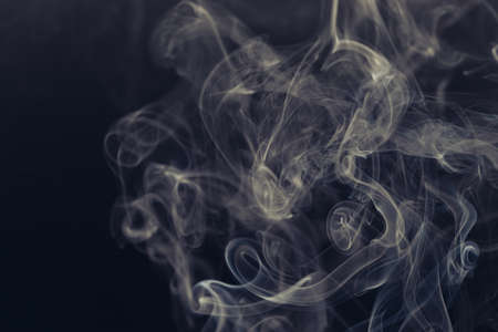 white smoke on a black backgroundの写真素材
