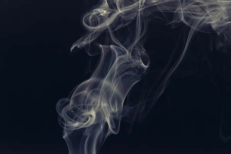 white smoke on a black backgroundの写真素材